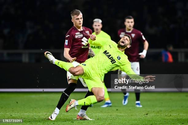 Domenico Berardi of US Sassuolo in action against Ivan Ilic of Torino FC during the Serie A TIM match between Torino FC and US Sassuolo at Stadio...