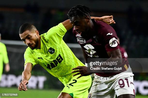 Jeremy Toljan of US Sassuolo against Duvan Zapata of Torino FC in action during the Serie A TIM match between Torino FC and US Sassuolo at Stadio...