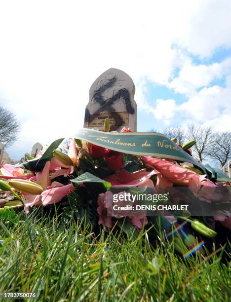 Close up of the wreath laid on a desecrate grave marked with the svastika on April 7, 2008 in Ablain-Saint-Nazaire, northern France in France's...