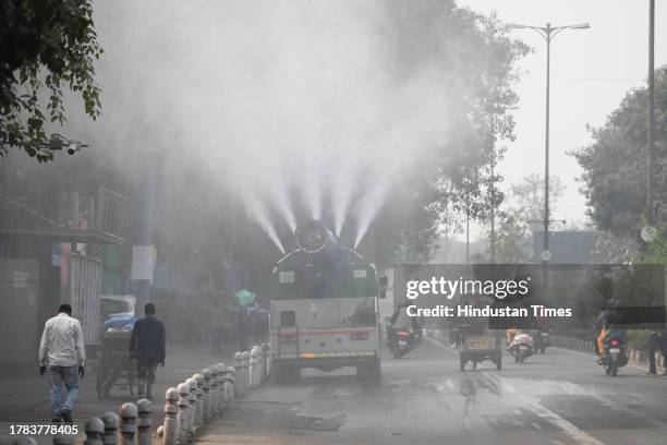 An Anti Smog truck seen sprinkling water to settle down dust particles at Chandni Chowk on November 15, 2023 in New Delhi, India.