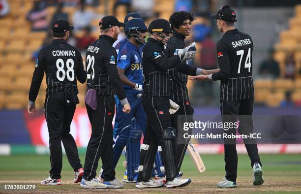 Rachin Ravindra of New Zealand celebrates the wicket of Dilshan Madushanka of Sri Lanka during the ICC Men's Cricket World Cup India 2023 between New...