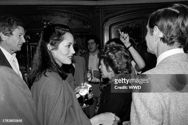 Barbara Carrera , Berthe Jourdan , and Louis Jourdan attend a party, celebrating the publication of Alexander Walker's "The Shattered Silents," at...