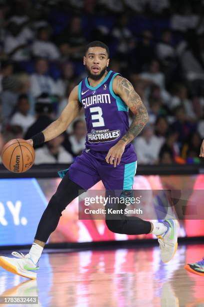 November 15: Terrell Brown Jr. #3 of the Greensboro Swarm looks for the open man against the Westchester Knicks on November 15, 2023 at The Novant...