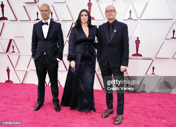 Jesse Collins, from left, Stacey Sher, and Steven Soderbergh arrive at the Oscars on Sunday, April 25 at Union Station in Los Angeles.