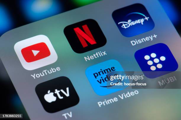 online streaming services netflix youtube disney plus amazon prime and apple tv on smart phone screen - streaming service stock pictures, royalty-free photos & images