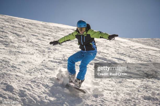 closeup view of snowboarder having fun in the mountains.winter holidays in ski resort - alpine skiing stock pictures, royalty-free photos & images