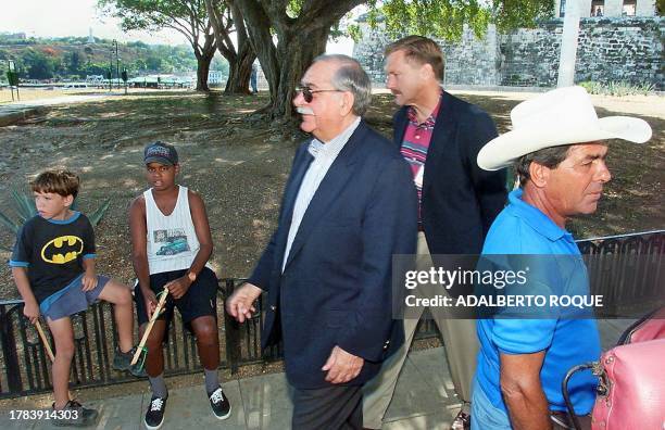 Joe Green , representative of the US company Caterpillar Americas Co., and William Hanson , manager of Great Lakes Dredge & Dock Company of US, walk...