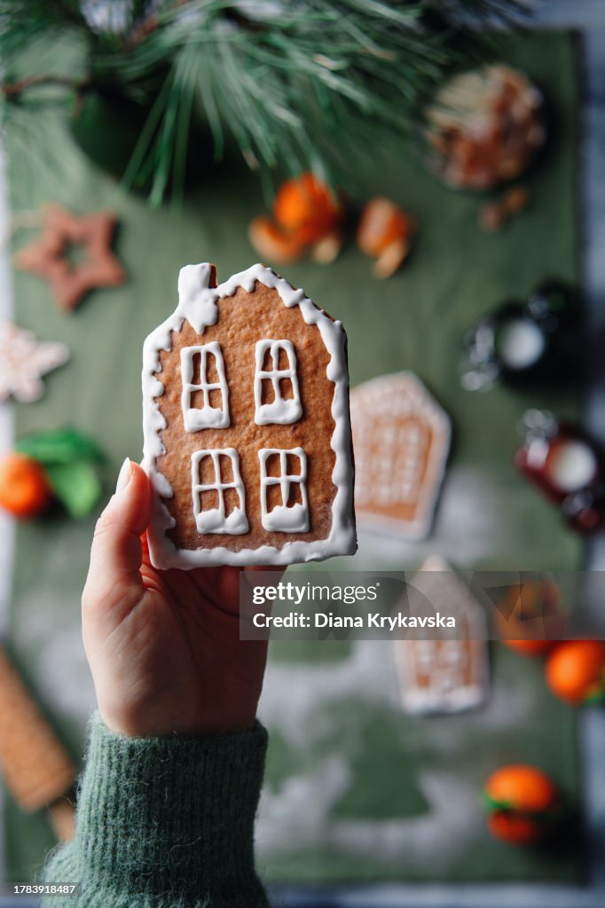 Woman holding Christmas gingerbread houses