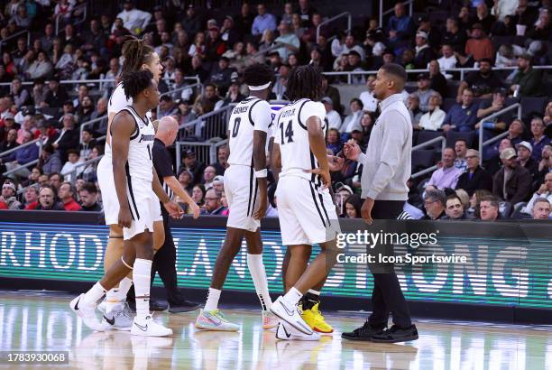 Providence Friars head coach Kim English speaks with his players during a college basketball game between Wisconsin Badgers and Providence Friars on...