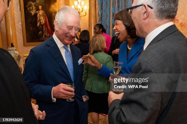 King Charles III smiles during a reception for delegates of the Overseas Territories Ministerial Council during at Buckingham Palace on November 15,...