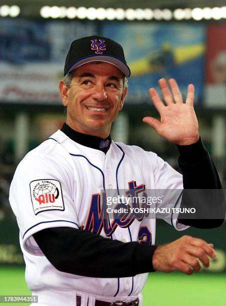 New York Mets manager Bobby Valentine waves to Japanese fans during the warm-up prior to the Mets' Major League Baseball opening game against the...