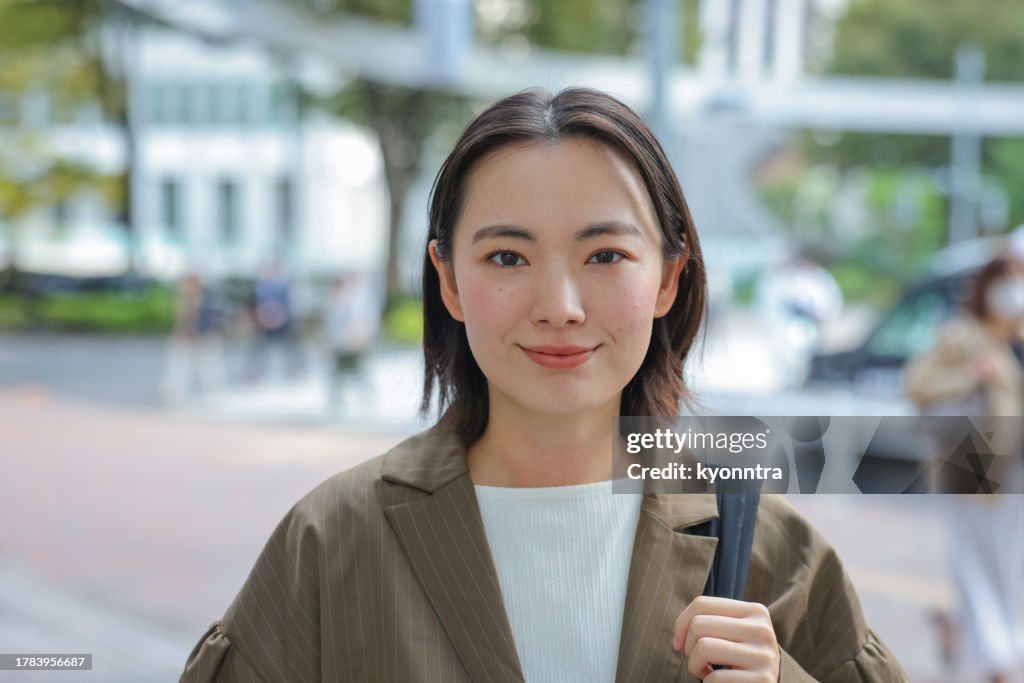 Portrait Of Young Asian Business Woman In Outdoors