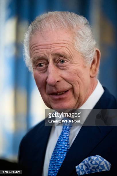 King Charles III smiles during a reception for delegates of the Overseas Territories Ministerial Council during at Buckingham Palace on November 15,...