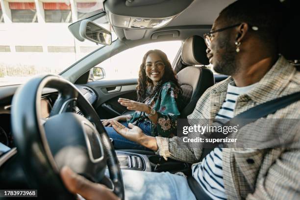 i enjoy riding with you - indian ethnicity man car stock pictures, royalty-free photos & images