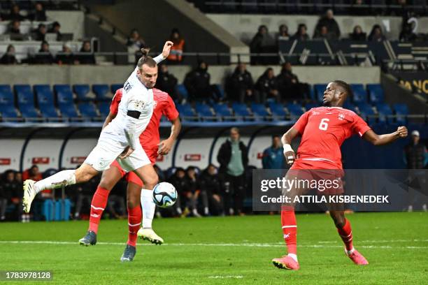 Israel's defender Sean Goldberg and Switzerland's midfielder Denis Zakaria vie for the ball during the UEFA Euro 2024 Group I qualification football...