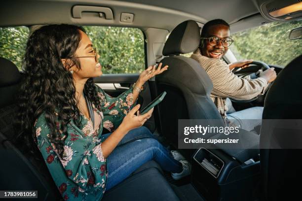 i love talking to my driver - crowdsourced taxi stock pictures, royalty-free photos & images