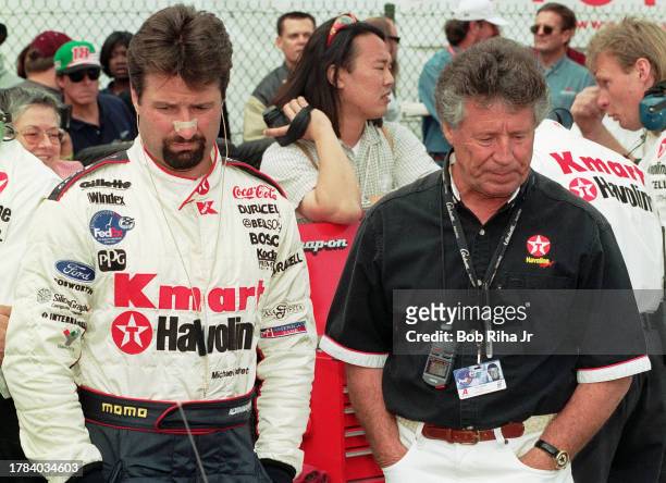 Racer Michael Andretti with his father and Team Owner former Racer Mario Andretti along pit row at Long Beach Grand Prix Race, April 3, 1998 in Long...