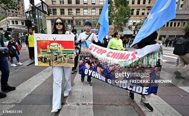 Demonstrators representing Tibetans and Uyghurs protest during the Asia-Pacific Economic Cooperation Leaders' Week in San Francisco, California, on...