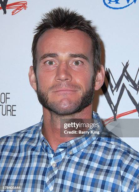 Professional Wrestler CM Punk attends the WWE SummerSlam VIP party on August 15, 2013 at the Beverly Hills Hotel in Beverly Hills, California.