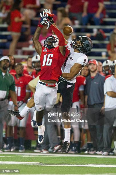 Cornerback Montell Garner of the South Alabama Jaguars breaks up a pass to wide receiver Fatu Moala of the Southern Utah Thunderbirds during the...