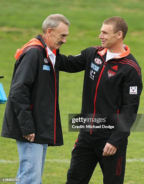 Bombers interim senior coach Simon Goodwin gestures to CEO Ray Gunston during an Essendon Bombers training session at Windy Hill on August 30, 2013...