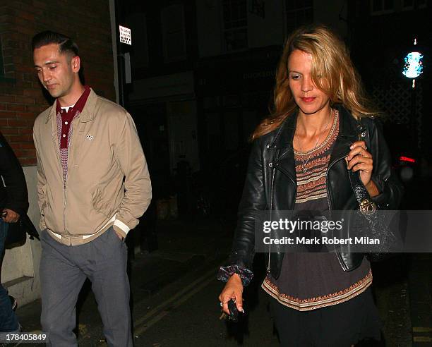 Reg Traviss and Lisa Moorish leaving the Groucho club on August 29, 2013 in London, England.
