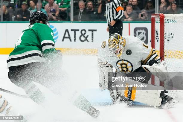 Jeremy Swayman of the Boston Bruins blocks a shot from Miro Heiskanen of the Dallas Stars during the third period at American Airlines Center on...