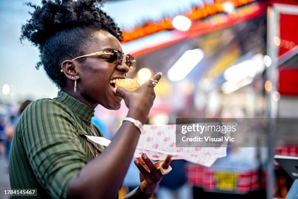 eating at the fair - fete stock pictures, royalty-free photos & images