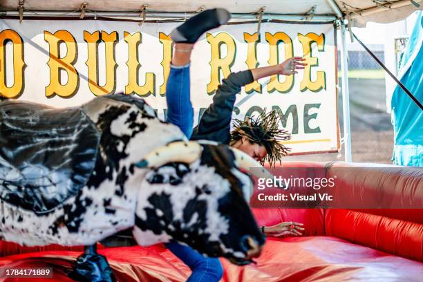 mechanical bull wins - mechanical bull stock pictures, royalty-free photos & images