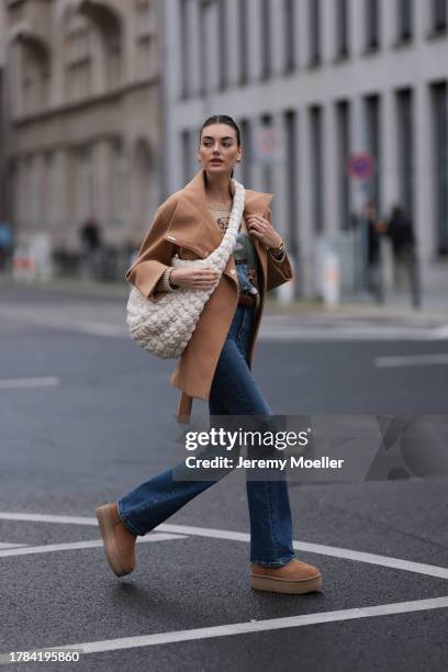 Celine Bethmann seen wearing gold earrings, Ralph Lauren beige wool teddy knit sweater, Liu Jo brown wool short coat, COS cream white crossbody bag,...