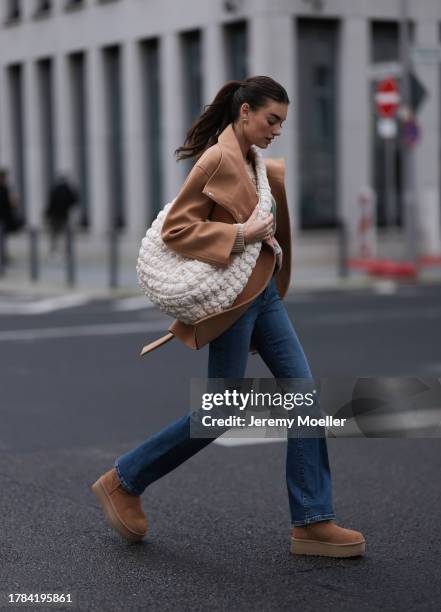 Celine Bethmann seen wearing gold earrings, Ralph Lauren beige wool teddy knit sweater, Liu Jo brown wool short coat, COS cream white crossbody bag,...