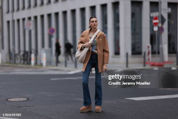 Celine Bethmann seen wearing gold earrings, Ralph Lauren beige wool teddy knit sweater, Liu Jo brown wool short coat, COS cream white crossbody bag,...