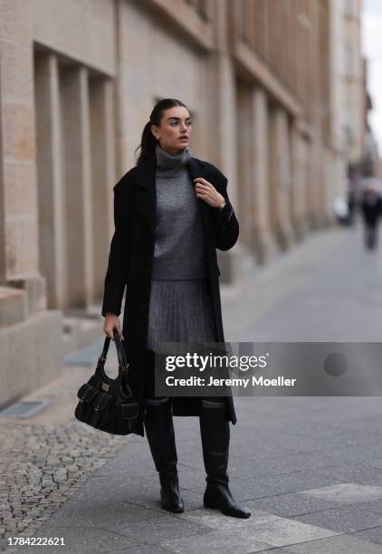 Celine Bethmann seen wearing gold earrings, Zara grey high neck wool knit pullover, matching Zara grey wool knit short skirt, Zara x Ader Error...