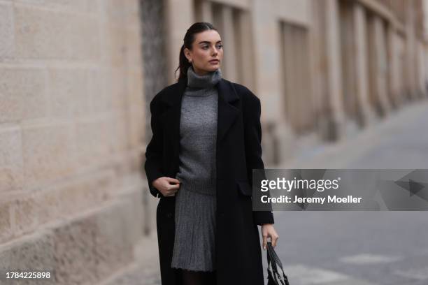 Celine Bethmann seen wearing gold earrings, Zara grey high neck wool knit pullover, matching Zara grey wool knit short skirt, Zara x Ader Error black...