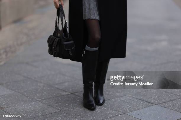 Celine Bethmann seen wearing Zara grey wool knit short skirt, Zara x Ader Error black long wool coat, Saint Sass black tights, Dior vintage black...