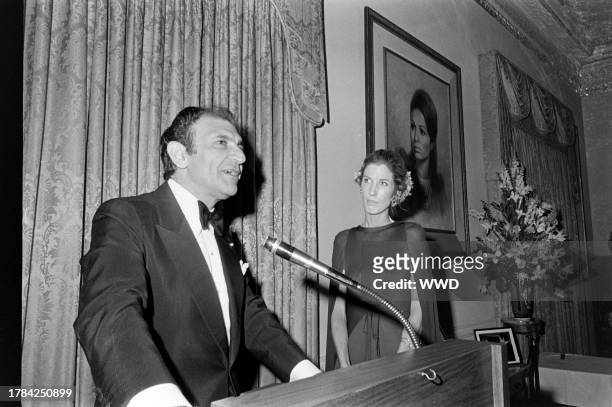Ardeshir Zahedi and Nancy Kissinger attend a party at the Iranian Embassy in Washington, D.C., on May 11, 1977.