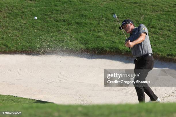 Ryan Palmer of the United States plays a shot from a bunker on the eighth hole during the first round of the Butterfield Bermuda Championship at Port...