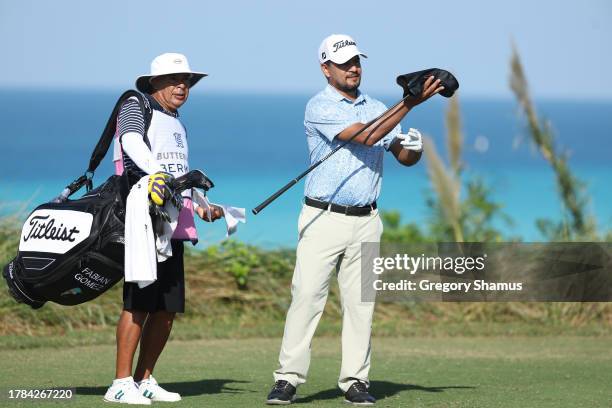 Fabian Gomez of Argentina selects a club on the ninth tee during the first round of the Butterfield Bermuda Championship at Port Royal Golf Course on...