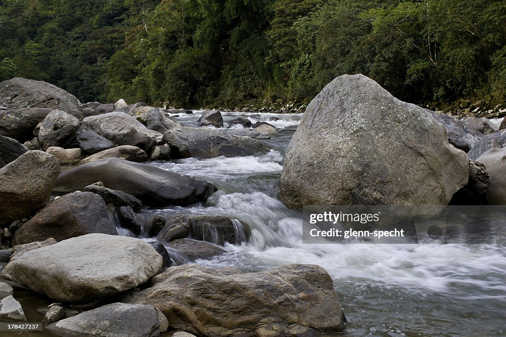 Water Flowing Near Rocks Water Flowing Over And Around Rocks High-Res Stock Photo - Getty Images