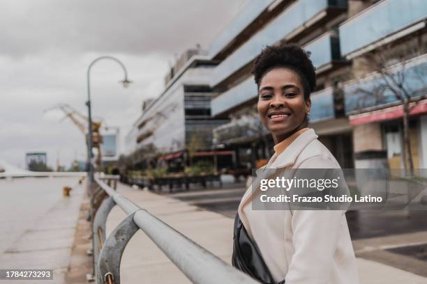 portrait of a young businesswoman in puerto madero, buenos aires - puerto stock pictures, royalty-free photos & images