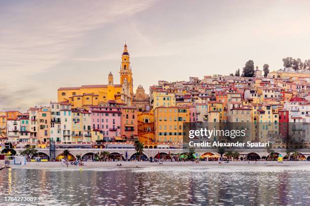 menton old town skyline with multi-colored vibrant houses at sunset, france - south of france stockfoto's en -beelden