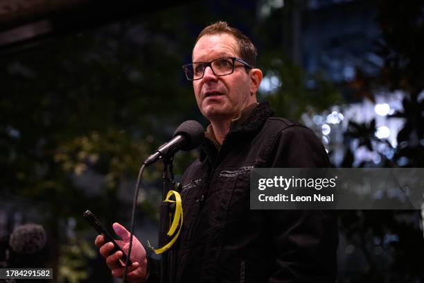 Noam Sagi, whose mother, Ada Sagi, was taken hostage by Hamas from the kibbutz of Nir Oz, near Israel's border with Gaza, addresses protestors as...