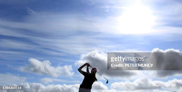 Paula Creamer of the US tees off of the 16th tee during her foursome match with Europe's Catriona Matthew and Azahara Munoz during the second day of...