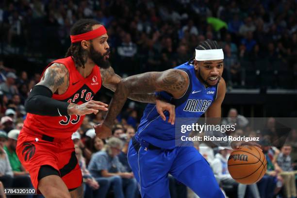 Gary Trent Jr. #33 of the Toronto Raptors guards Jaden Hardy of the Dallas Mavericks as he drives past at American Airlines Center on November 08,...