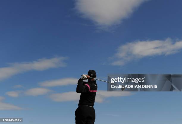 Golfer Tiger Woods plays his tee shot on the 9th during his third round on day three of the British Open Golf Championship at St Andrews in Scotland,...