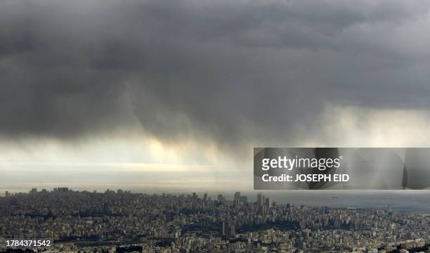 Heavy clouds cover the sky over the Lebanese capital Beirut on February 5, 2010. A cold wave is hitting the Middle East this week. AFP PHOTO/JOSEPH...