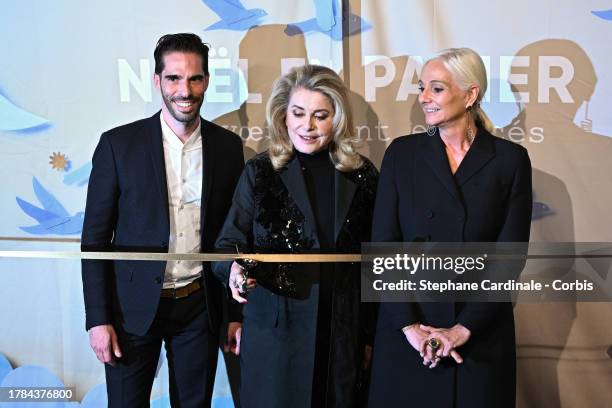 Le Printemps chief marketing and communication officer Stephane Roth, actress Catherine Deneuve and Le Printemps Haussmann managing director Laurence...