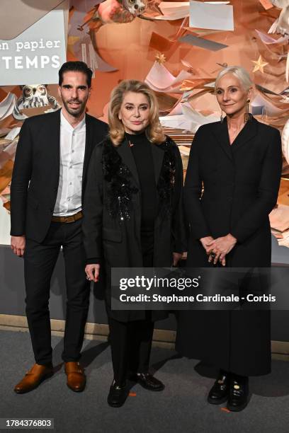 Le Printemps chief marketing and communication officer Stephane Roth, actress Catherine Deneuve and Le Printemps Haussmann managing director Laurence...