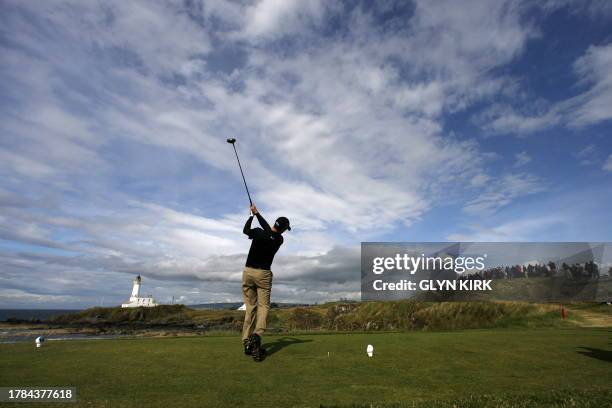 English golfer Ross Fisher drives from the 9th tee, on the third day of the 138th British Open Championship at Turnberry Golf Course in south west...