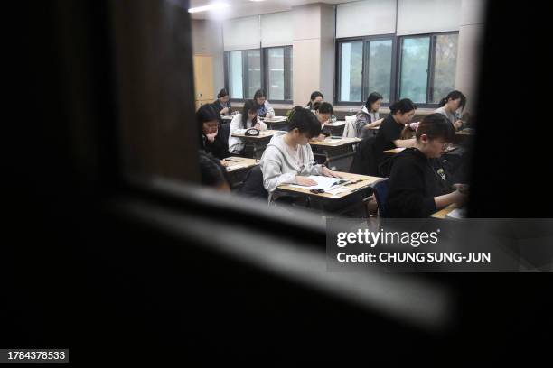 South Korean students wait to take the annual College Scholastic Ability Test, known locally as Suneung, at a school in Seoul on November 16, 2023.